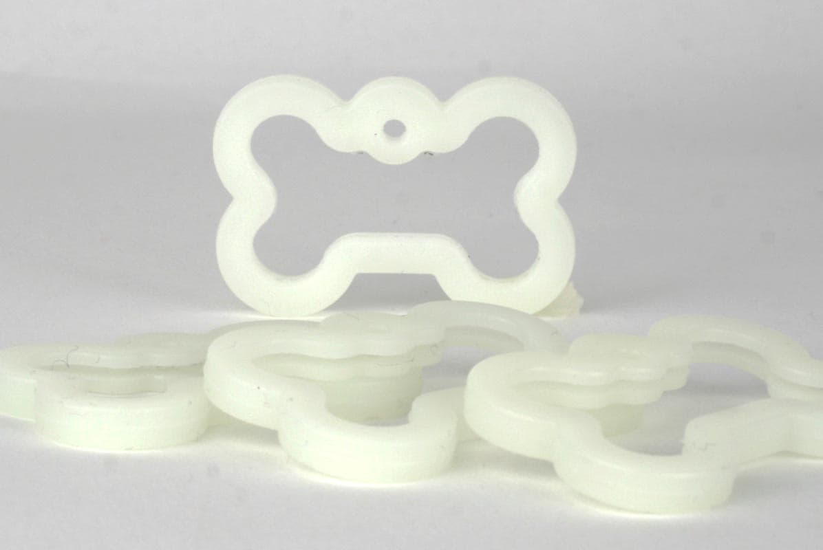 Bell shaped shop dog tag silencer