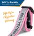 Close-up of pink personalized dog collar showing reflective nylon webbing and quick release buckle with Soft Yet Durable text