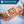 Load image into Gallery viewer, Orange personalized reflective waterproof dog collar with metal buckle, water and mud splashes, labeled Adventure Ready
