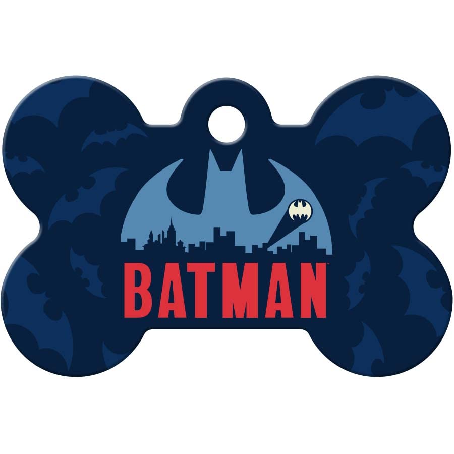 Front view of DC Comics Batman bone dog ID tag showing blue bat emblem, red BATMAN text, and bat silhouettes on dark blue background