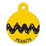Front view of Peanuts ID tag showing Charlie Brown black zigzag and PEANUTS text on yellow brass tag with white background