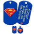 Front and back of blue Superman dog ID tags showcasing red-yellow S shield and sample vertical laser-engraved contact text