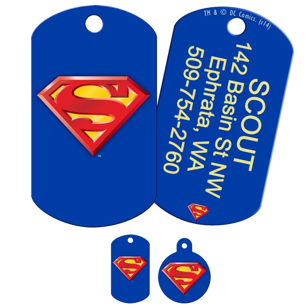 Front and back of blue Superman dog ID tags showcasing red-yellow S shield and sample vertical laser-engraved contact text
