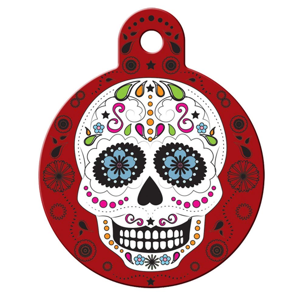 Front view of round Day of the Dead dog ID tag showing colorful sugar-skull design on red with attachment hole on white background