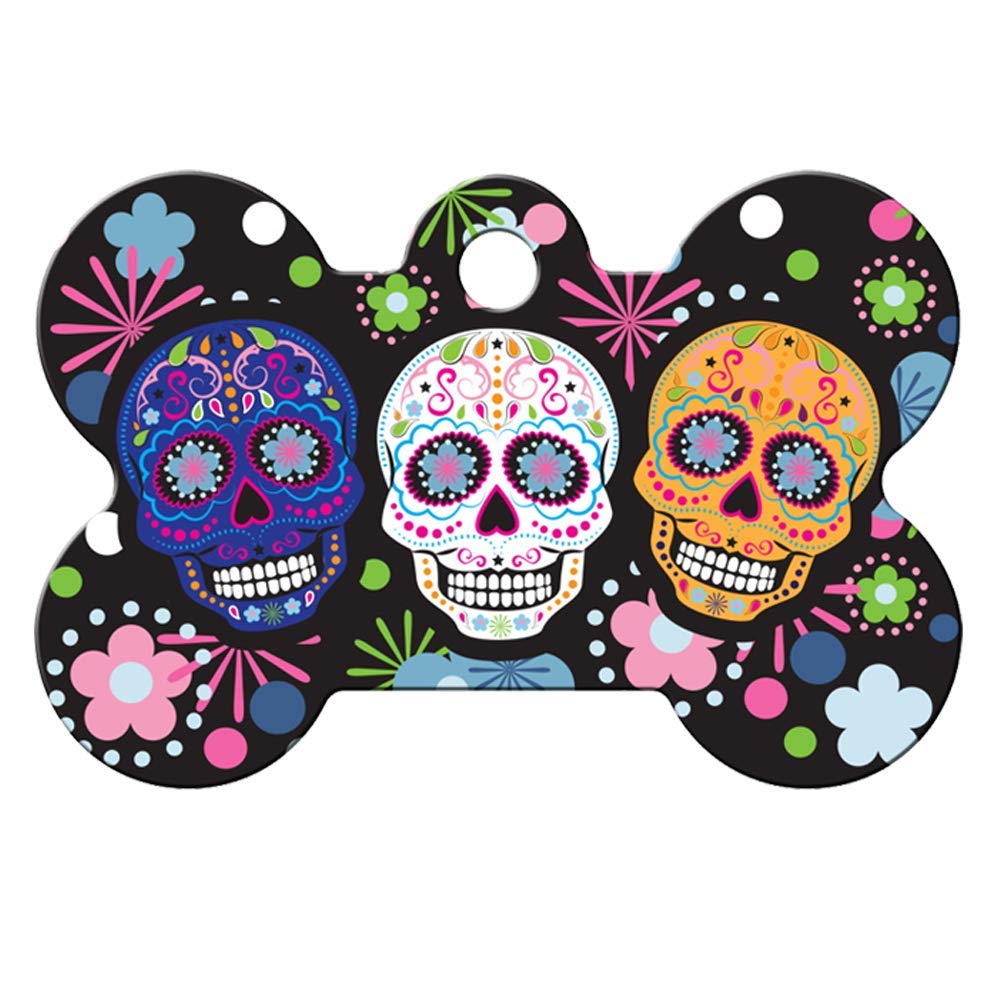 Front view of Day of the Dead dog ID tag showcasing three colorful sugar skulls on a bone-shaped black background