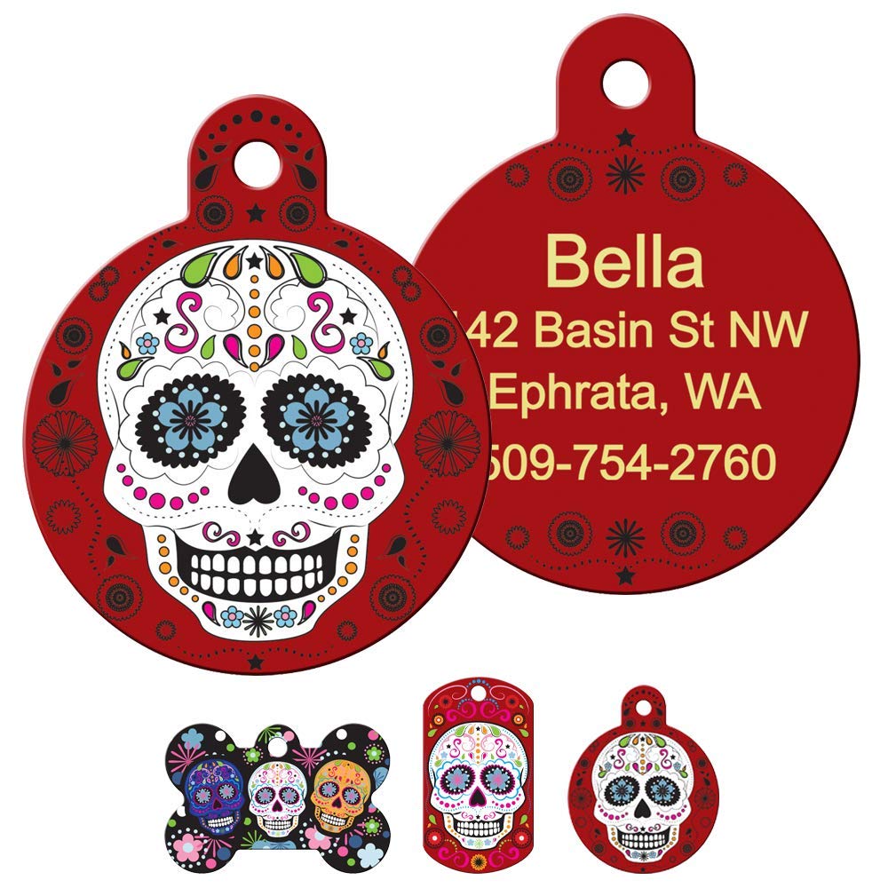 Front and back of round Day of the Dead dog tag showcasing colorful sugar-skull art and engraved name and phone number on a red back
