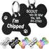 Close-up of black stainless steel bone-shaped dog tag showing white I’m Chipped text, engraved back text, and metal rings
