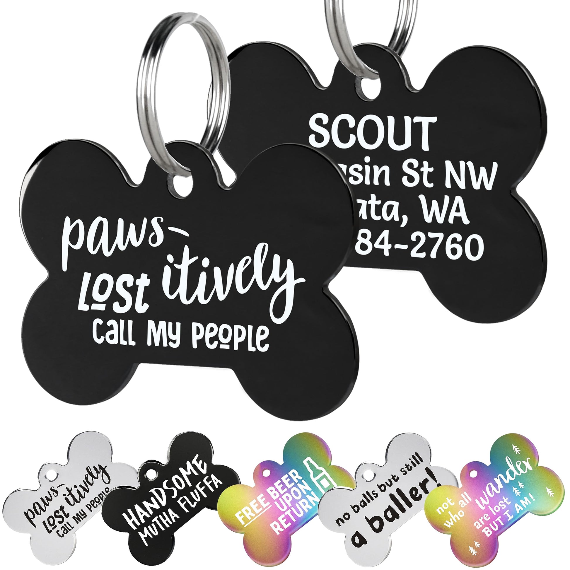 Close-up of two black stainless steel dog ID tags showing white funny front text and engraved back personalization, 1.25 x 1 in, white background