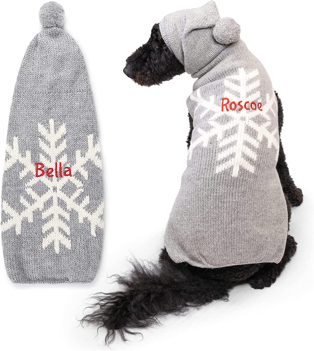 Back view of Snowflake dog sweater showing white snowflake, hood pompom, and red name ‘Roscoe’ on white background