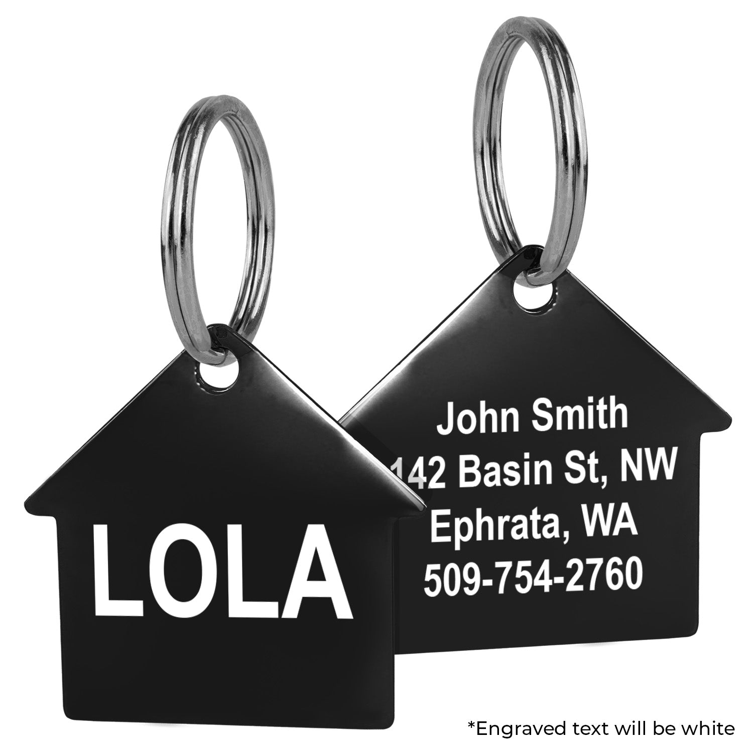 Close up of black stainless steel house shaped pet ID tag, double sided sample engraving LOLA and split rings on white