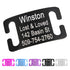 Angled close-up of black Silent Slide-On Dog ID tag with white engraving showing sample name Winston and contact info