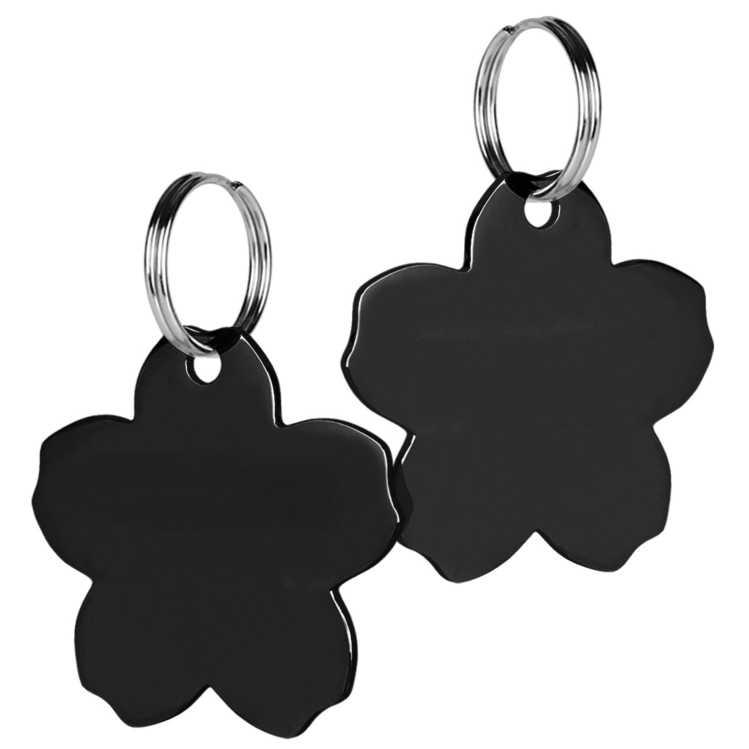 Close-up front and back view of black flower-shaped pet ID tags with polished stainless steel finish and split rings