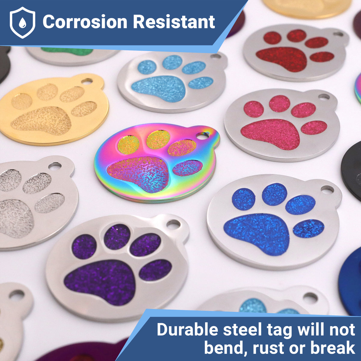 Flat lay of stainless steel glitter paw-print pet ID tags in assorted colors, corrosion-resistant, on white background