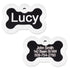 Front and back of black anodized bone pet ID tag showing glow-in-the-dark silencer and sample engraving 'Lucy' on white background