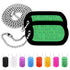 Angled view of embossed US military dog tag necklace set with green anodized tags, ball chains, silencers, and eight colors