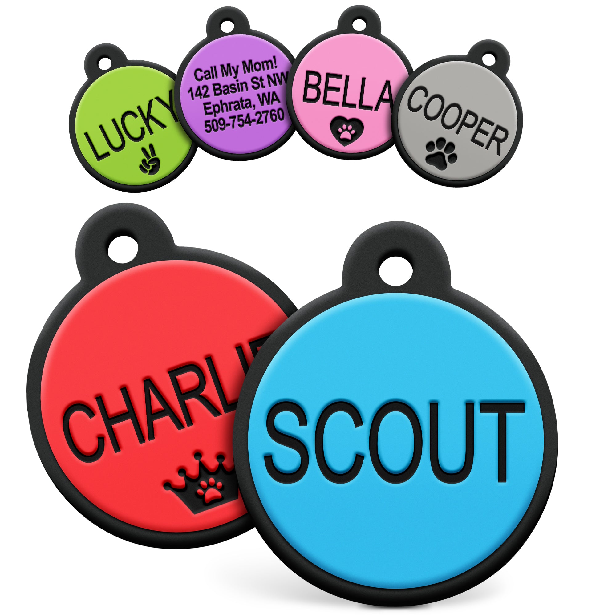 Angled view of round silent silicone pet ID tags, black-rimmed colorful discs engraved with sample names on white background
