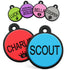 Angled view of round silent silicone pet ID tags, black-rimmed colorful discs engraved with sample names on white background