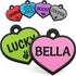 Close-up of heart-shaped silicone pet ID tags showcasing personalized engraved text in multiple colors on a white background