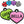 Load image into Gallery viewer, Close-up of heart-shaped silicone pet ID tags showcasing personalized engraved text in multiple colors on a white background
