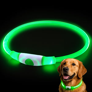 Front view of a light-up LED dog collar showcasing its green glow against a black background