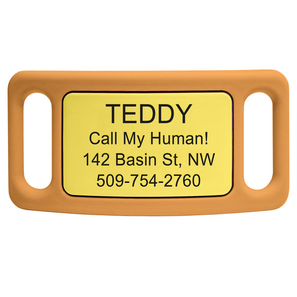 Close-up front view of slide-on pet ID tag with yellow plate engraved TEDDY and Call My Human in orange silicone frame