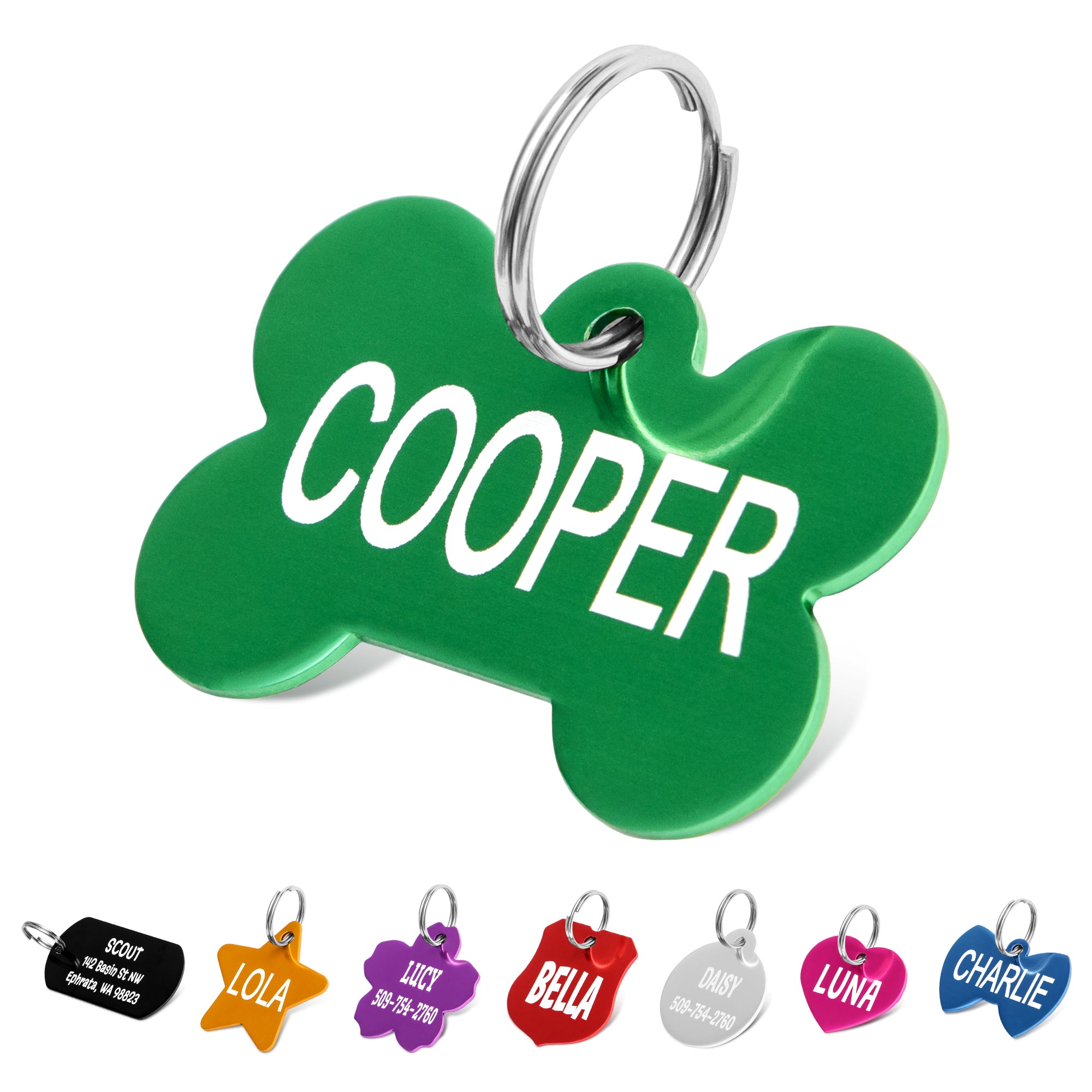 Close-up of green aluminum bone-shaped dog tag engraved with name Cooper and split ring on white background