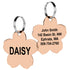Front and back view of rose gold flower pet ID tag showing engraved DAISY and sample address and phone on white