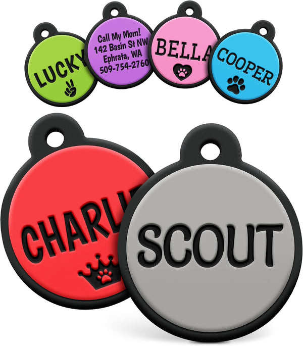 Angled view of round silent silicone pet ID tags showcasing colorful options and sample engravings on a white background
