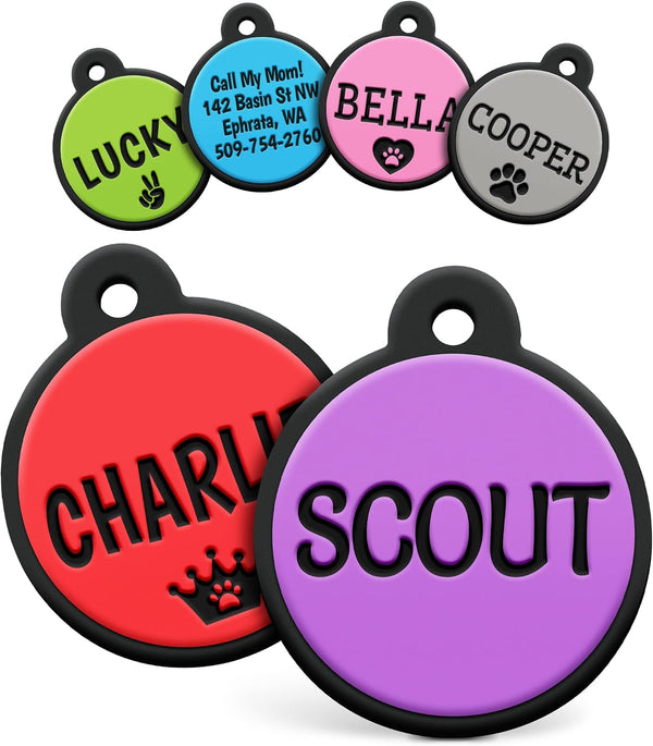 Front view of a purple Round Silent Silicone Pet ID Tag showcasing engraved SCOUT text with colorful tags in background
