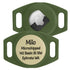 Close-up of Matcha green AirTag silicone holder showing an inserted Apple AirTag and engraved pet name “Milo” on the beige ID plate