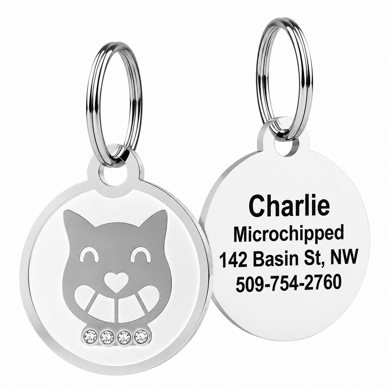 Front and back of Swarovski crystal pet ID tag, cat crown with four crystals and sample engraved contact on white
