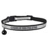 Front view of a black reflective cat collar showcasing engraved name and phone number, breakaway buckle, and bell on white background