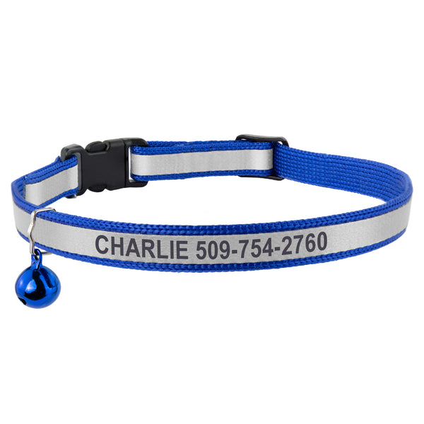 Blue reflective cat collar engraved CHARLIE and a phone number, with breakaway buckle and bell on white background