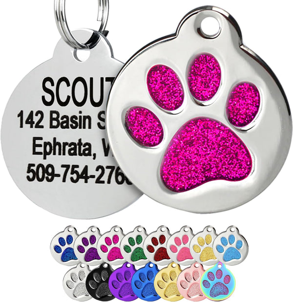 Close-up of Glitter Paw Print Pet ID Tag showing pink glitter, polished stainless steel, engraved back, and attachment ring