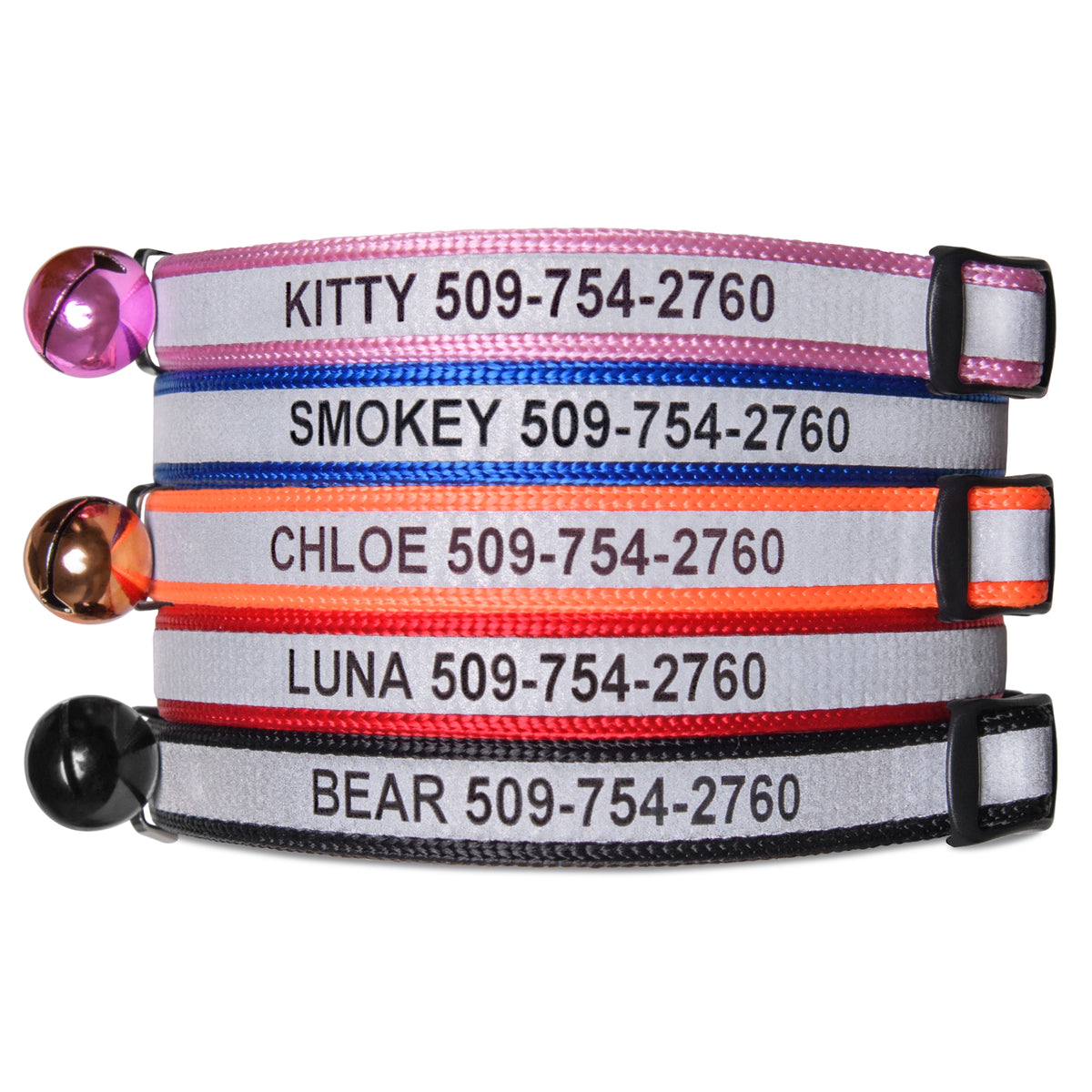 Close-up of stacked personalized engraved reflective cat collars showing engraved names and phone numbers, reflective strip, breakaway buckles and attached bells