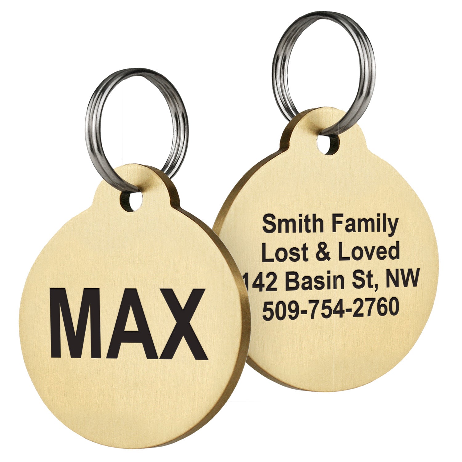 Front and back of round brass pet ID tags showing bold MAX name engraving and sample engraved family name, address and phone on white background