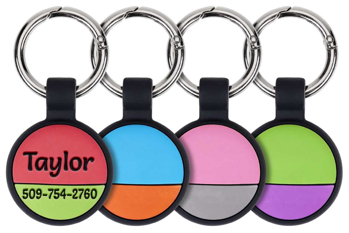Front view of personalized silicone AirTag keyrings showcasing deep engraved custom text and metal split rings in assorted colors on white background