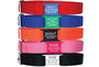Stacked view of nylon dog collars showcasing personalized slide-on nameplates with sample engraved text on white background
