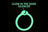 Glowing pet tag silencer showing glowing ring and overlay text GLOW IN THE DARK SILENCER on black background