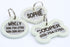 Front close-up of three stainless steel pet ID tags (bone, round, heart) showing glow-in-the-dark silencers and engraved names on white background